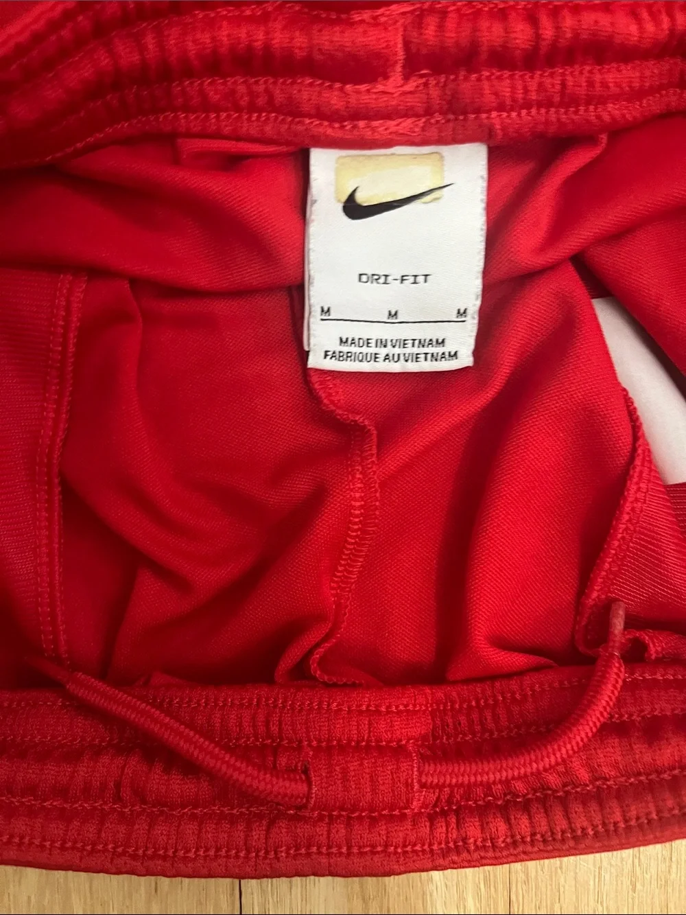 Nike Red Athletic Shorts with White Swoosh